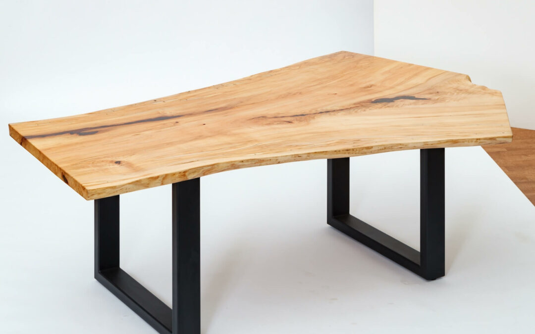 Morris Hill Metal Craft Quarryville, PA A live edge wooden table with black legs.
