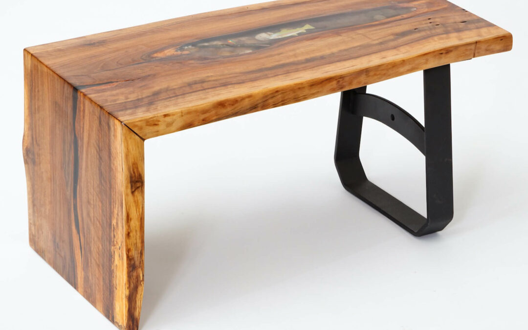 Morris Hill Metal Craft Quarryville, PA A live edge wooden coffee table with a black metal base.