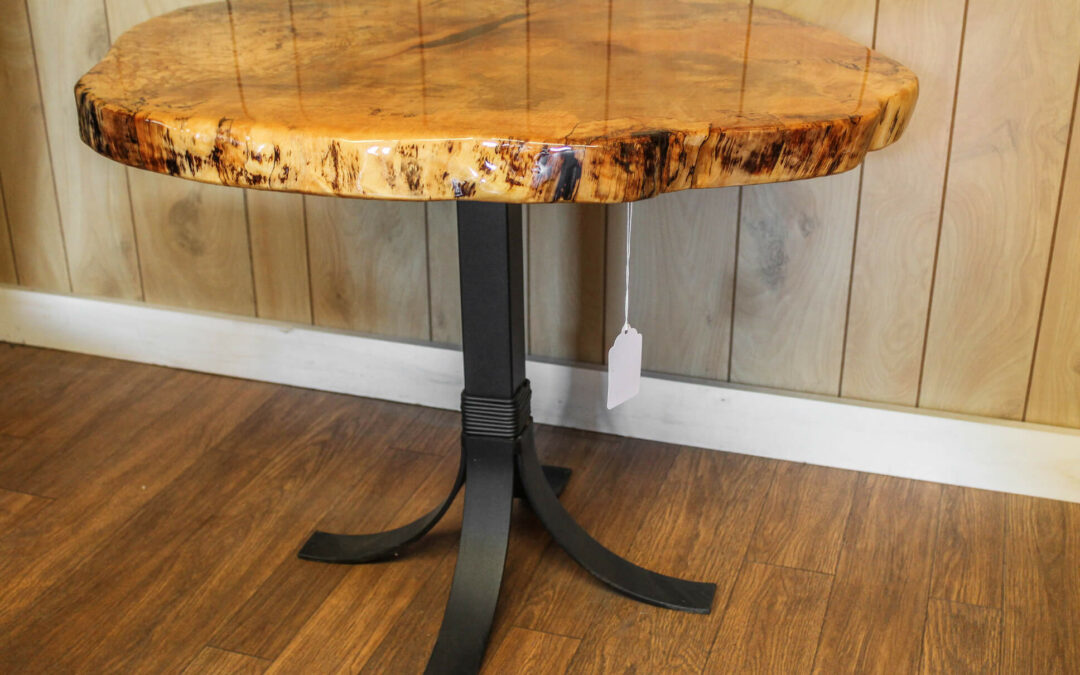 Morris Hill Metal Craft Quarryville, PA A round table with a live edge wood top and a black metal base.
