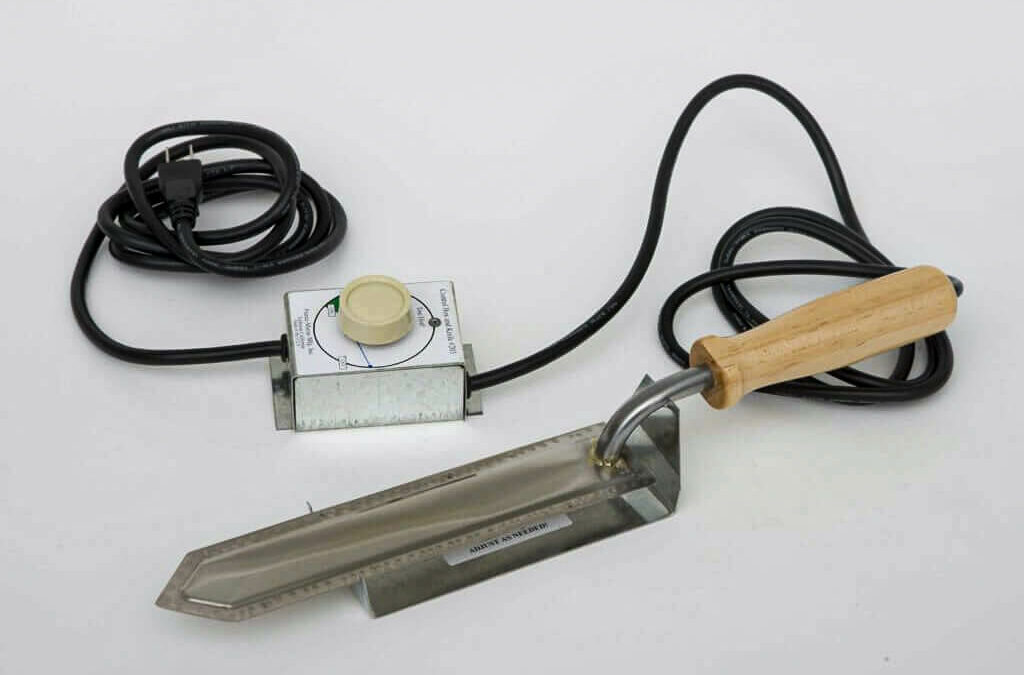 Forest Hill Woodworking Paradise PA A tool with a wooden handle and a cord.