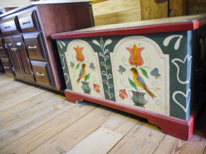 A painted chest of drawers in a furniture store