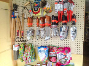 A wall with tools and other items.