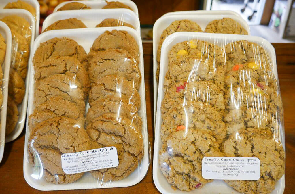 Wayside Produce East Earl PA A display of cookies in plastic containers on a table.