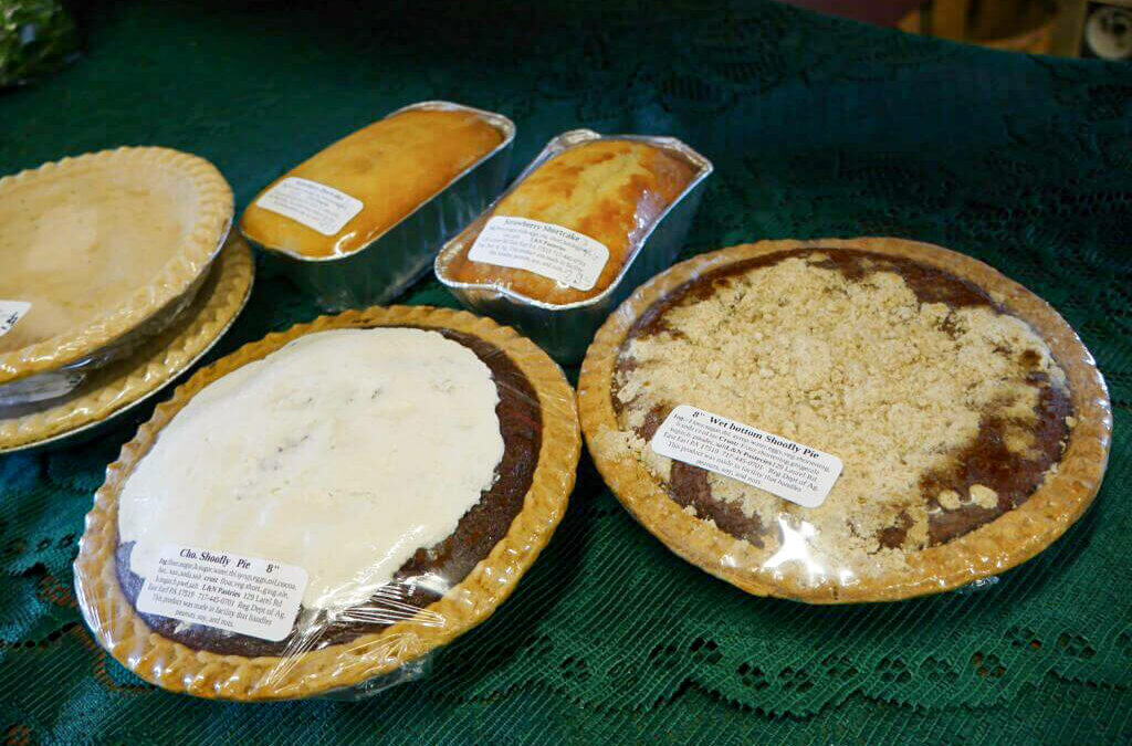 Wayside Produce East Earl PA Pies are sitting on a table in front of a green cloth.