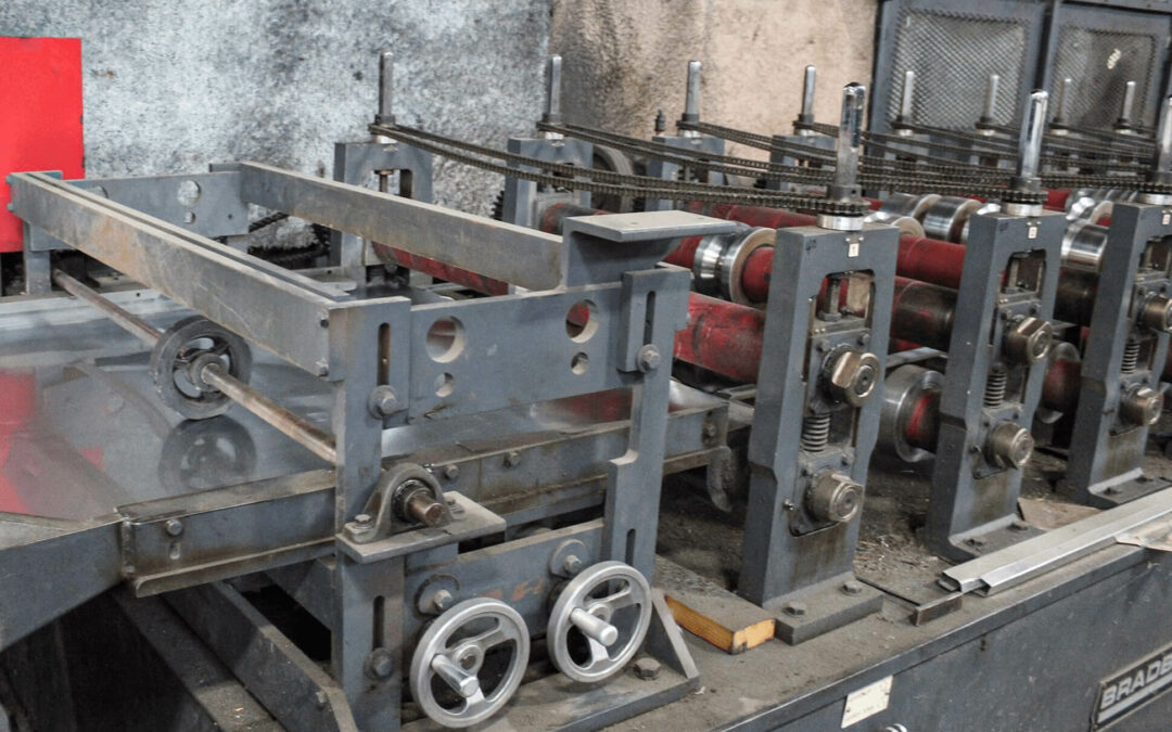 Slate Road Supply Ephrata PA Industrial machinery with metal frames and rotary handles in a factory setting.