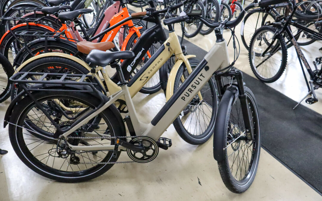 Weaver's Bike Shop Ephrata PA A group of electric bicycles on display in a store, with one prominently marked “Pursuit”.
