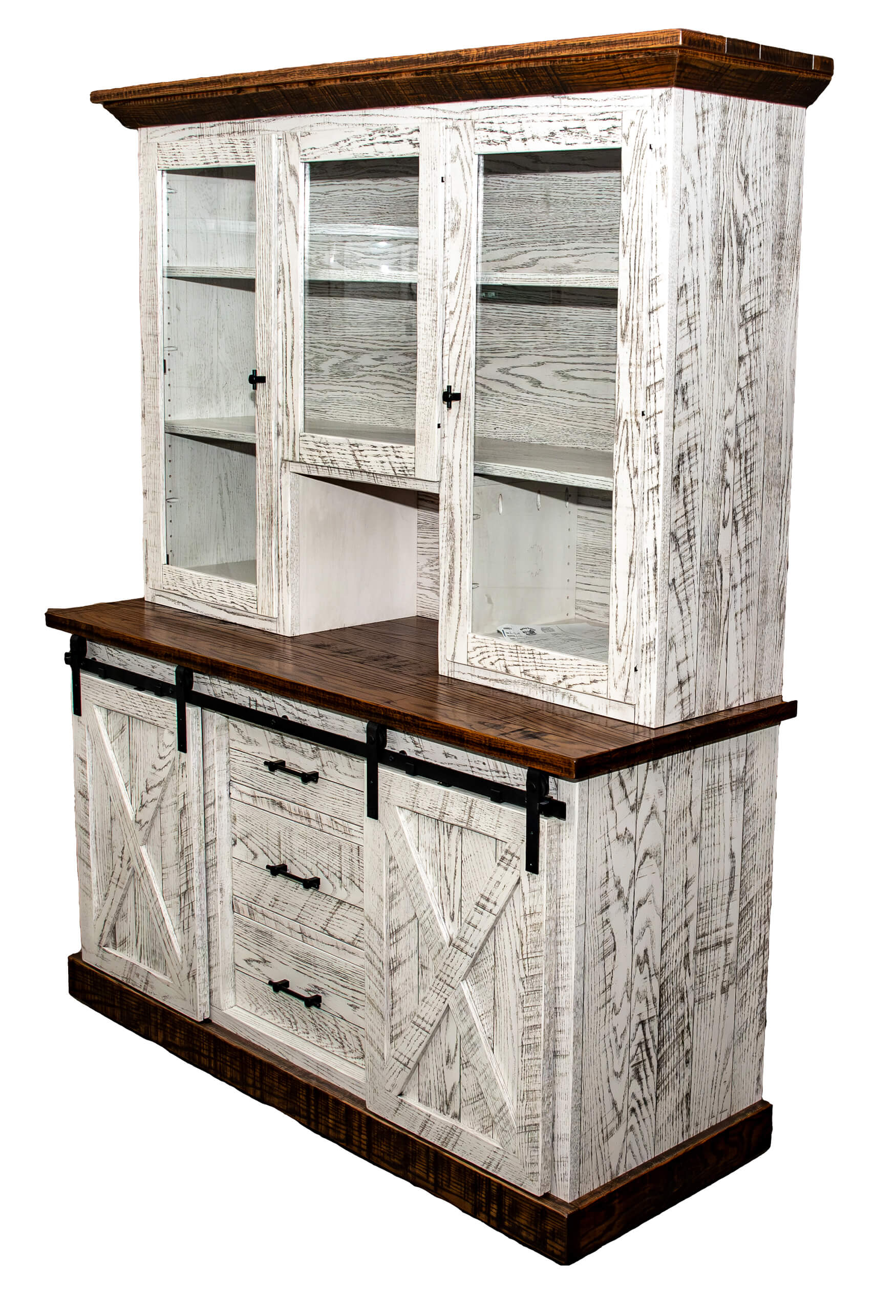 7.8.26 Spring Valley Woodworking Cabinets, Hutches, and Storage Gallery 10 White distressed wood hutch with glass upper doors, sliding barn-style lower doors, and three central drawers; dark wood top and accents.