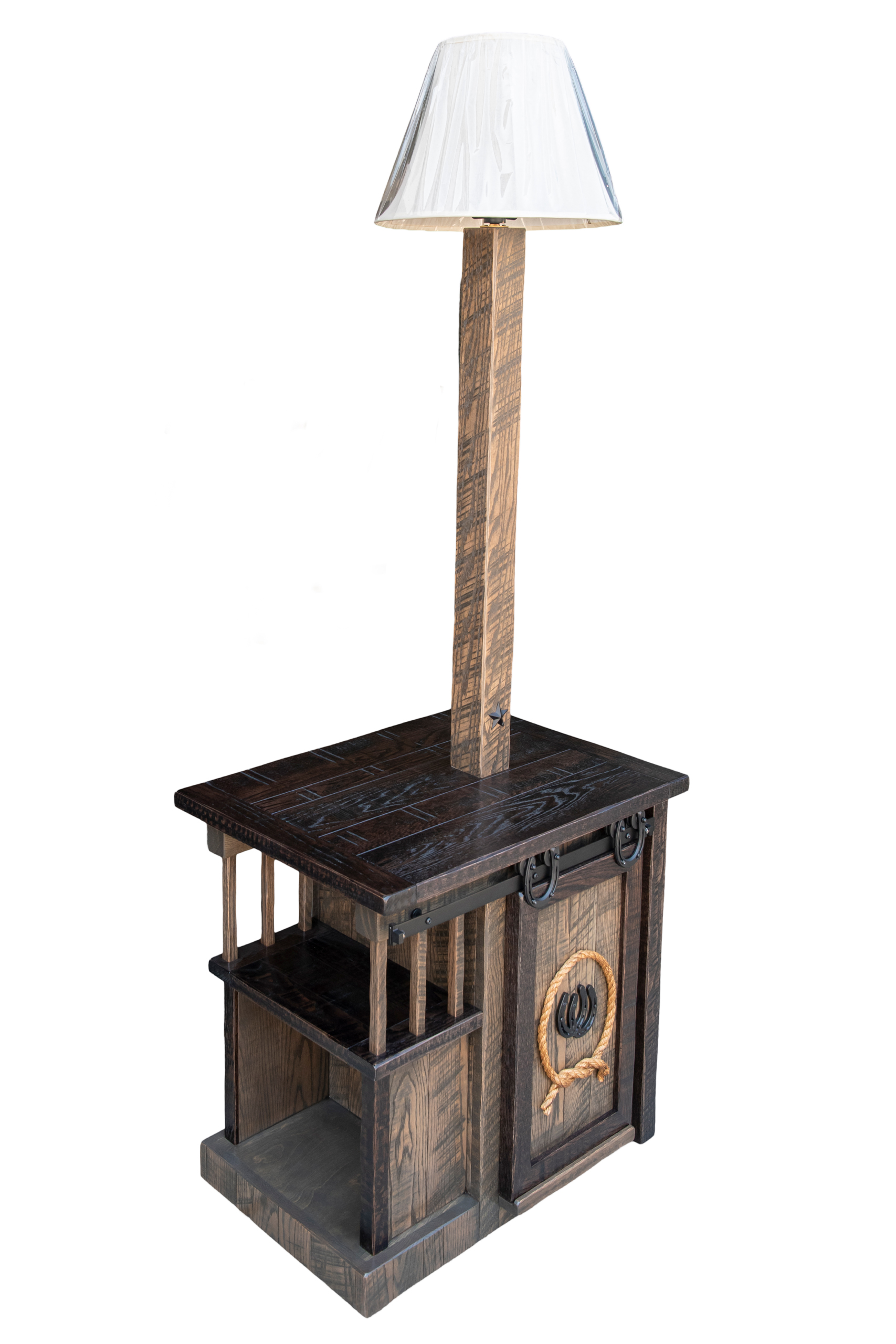 7.8.26 Spring Valley Woodworking Light Fixtures Gallery 5 A rustic wooden end table with shelves, a drawer, decorative ring accents, and an attached lamp with a white shade.