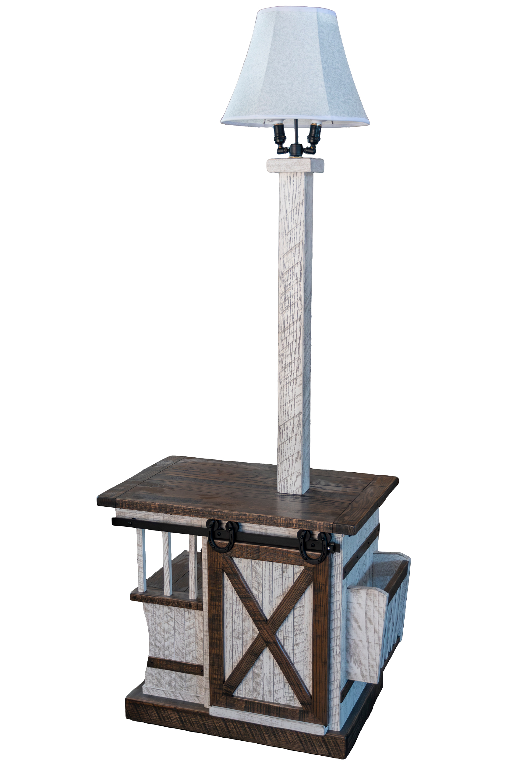 7.8.26 Spring Valley Woodworking Light Fixtures Gallery 9 A rustic wooden end table with a barn door design, attached vertical post, and a lamp with a white shade on top.